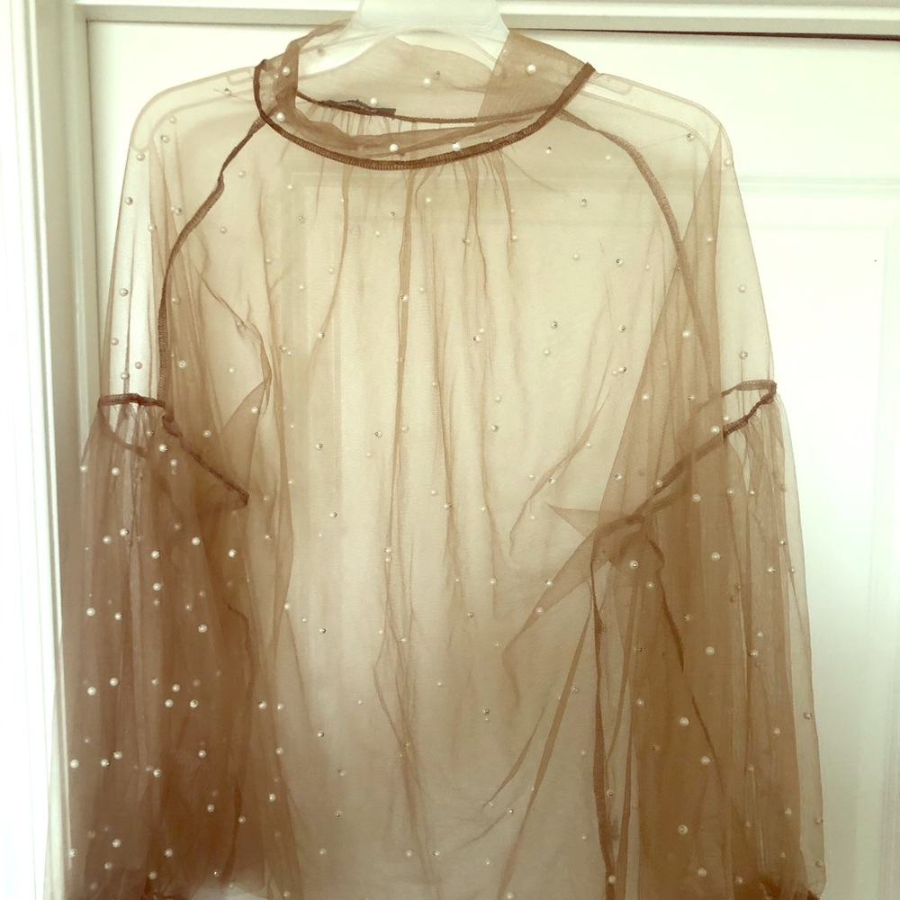 Sheer tunic w/pearl detailing.